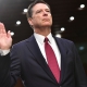 FORMER FBI DIRECTOR JAMES COMEY SURRENDERS TO AUTHORITIES