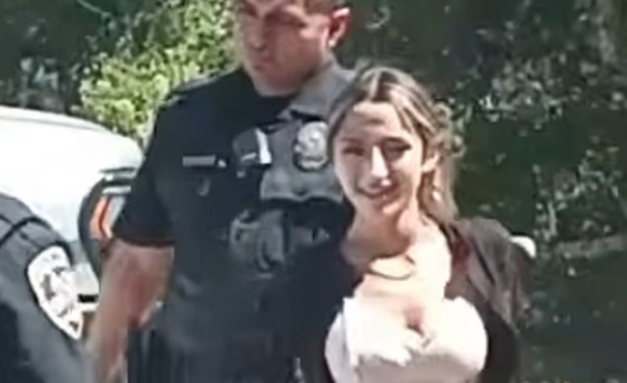 TWO YOUNG SISTERS SMILE FOR THE CAMERA AS THEY ARE ARRESTED FOR MURDER