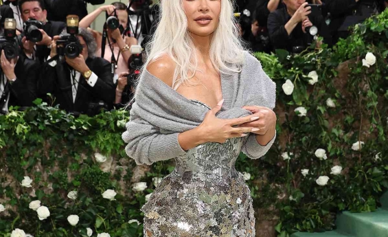 KIM KARDASHIAN STUNS IN A TIGHT CORSET AND SHEER GOWN AT 2024 MET GALA
