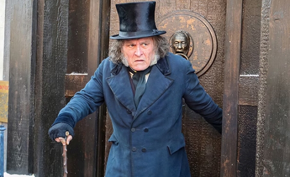 JOHNNY DEPP MAKES SURPRISE COMIC-CON APPEARANCE AS UNRECOGNIZABLE EBENEZER SCROOGE