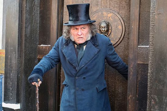 JOHNNY DEPP MAKES SURPRISE COMIC-CON APPEARANCE AS UNRECOGNIZABLE EBENEZER SCROOGE