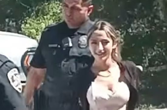TWO YOUNG SISTERS SMILE FOR THE CAMERA AS THEY ARE ARRESTED FOR MURDER