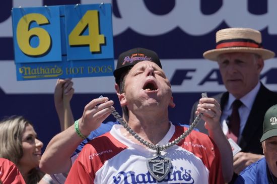 JOEY CHESTNUT EATS 66 HOT DOGS TO AGAIN CLAIM MUSTARD BELT